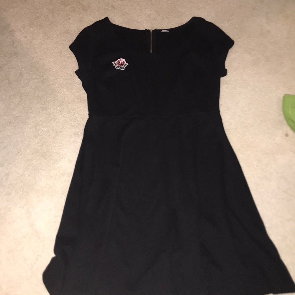 black dress with a vans rose patch